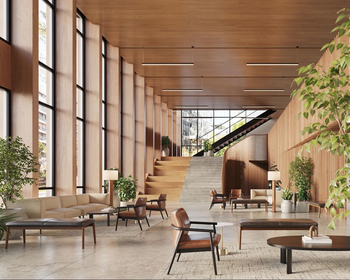 Warm, upscale commercial lobby with wood, greenery, and natural light